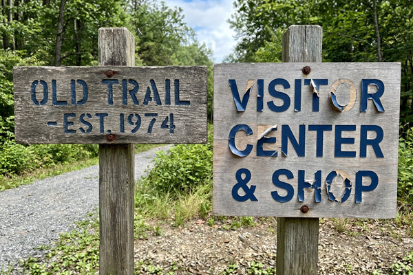 old sign and sign with vinyl peeling off